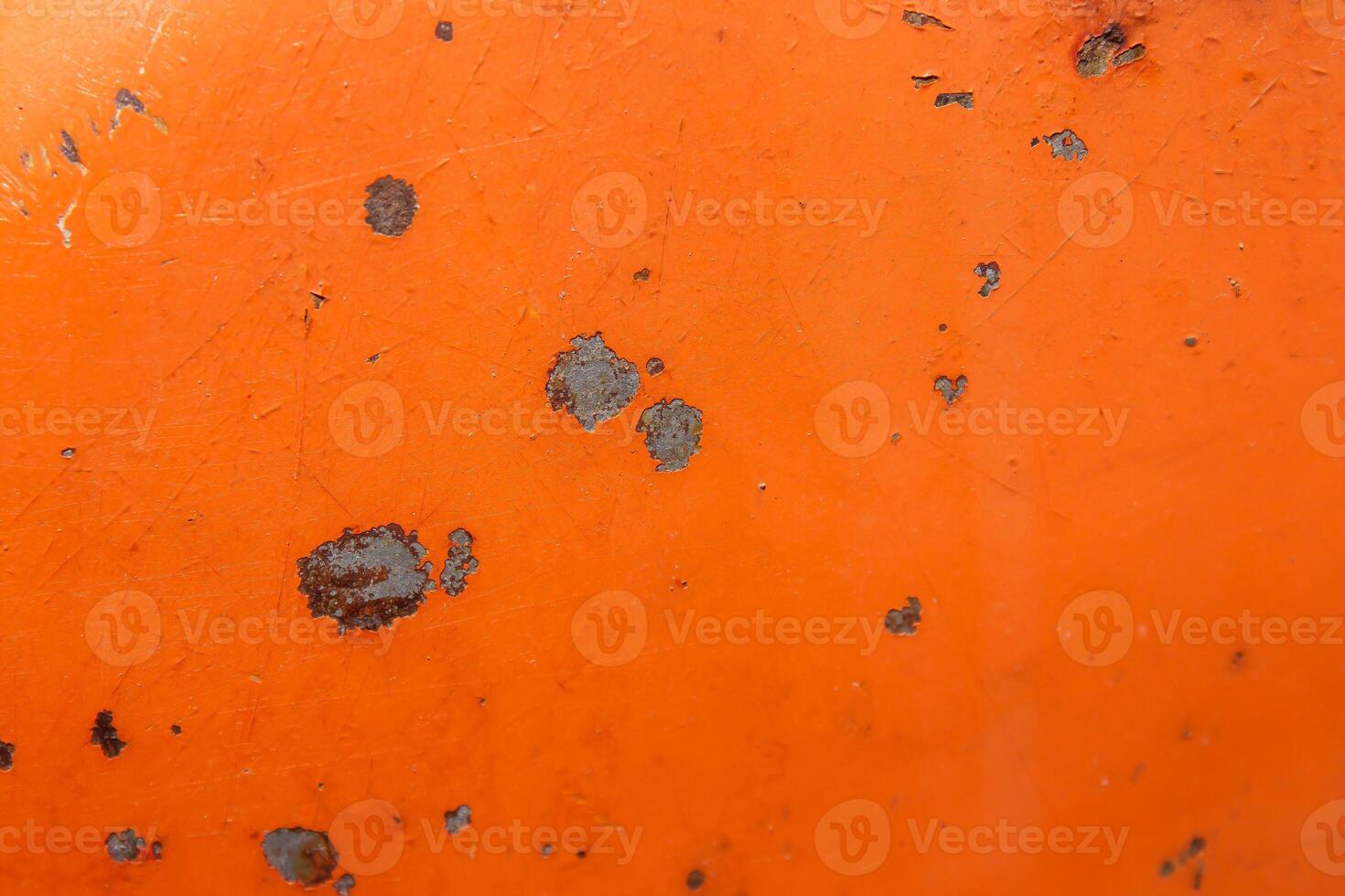 A close up of a orange object with a few spots photo