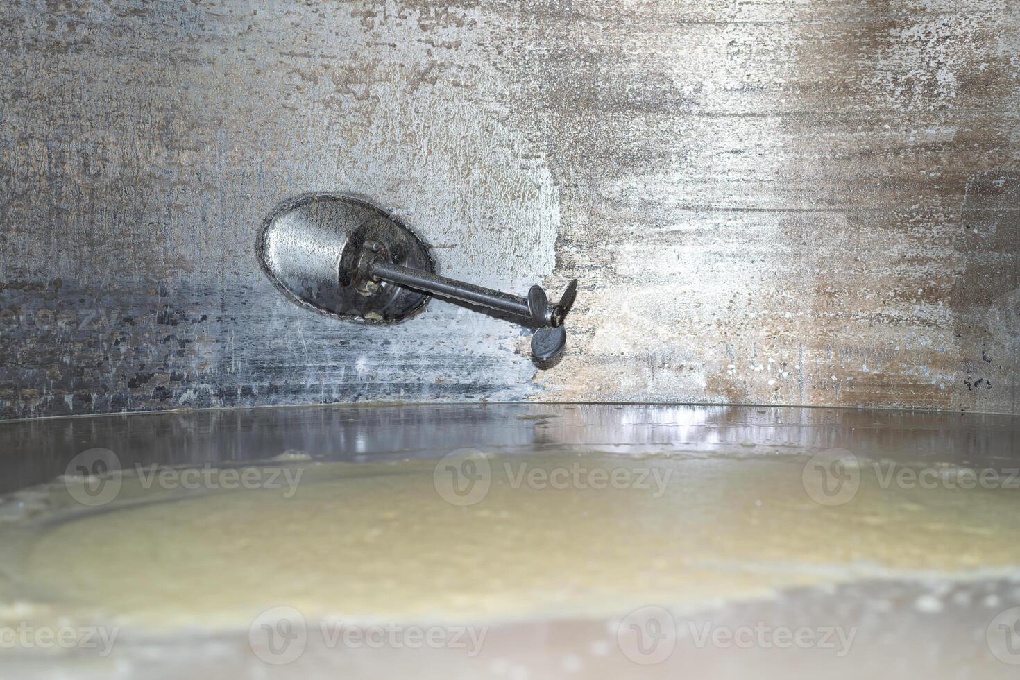Vat with fermentation braga of the distillery. View of braga photo