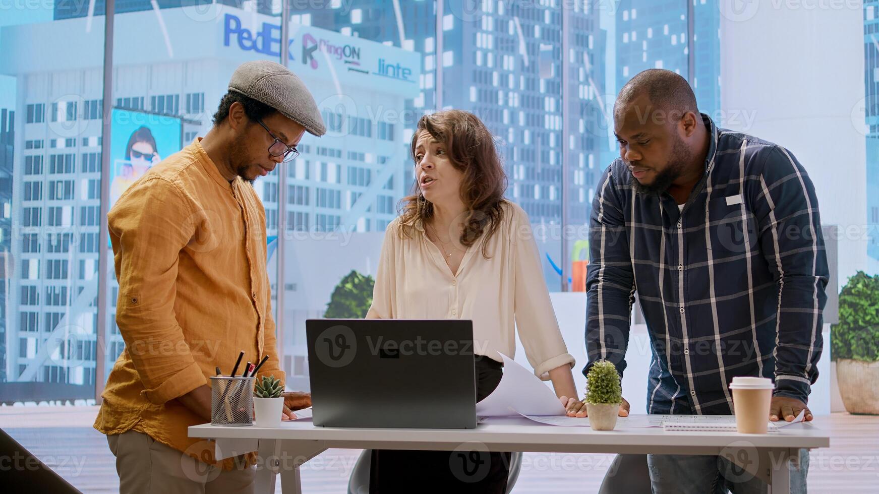 Business professionals and a real estate agent engage in a planning session, discussing the layout and design of a new office space based on detailed blueprints. Property investment. Camera A. photo