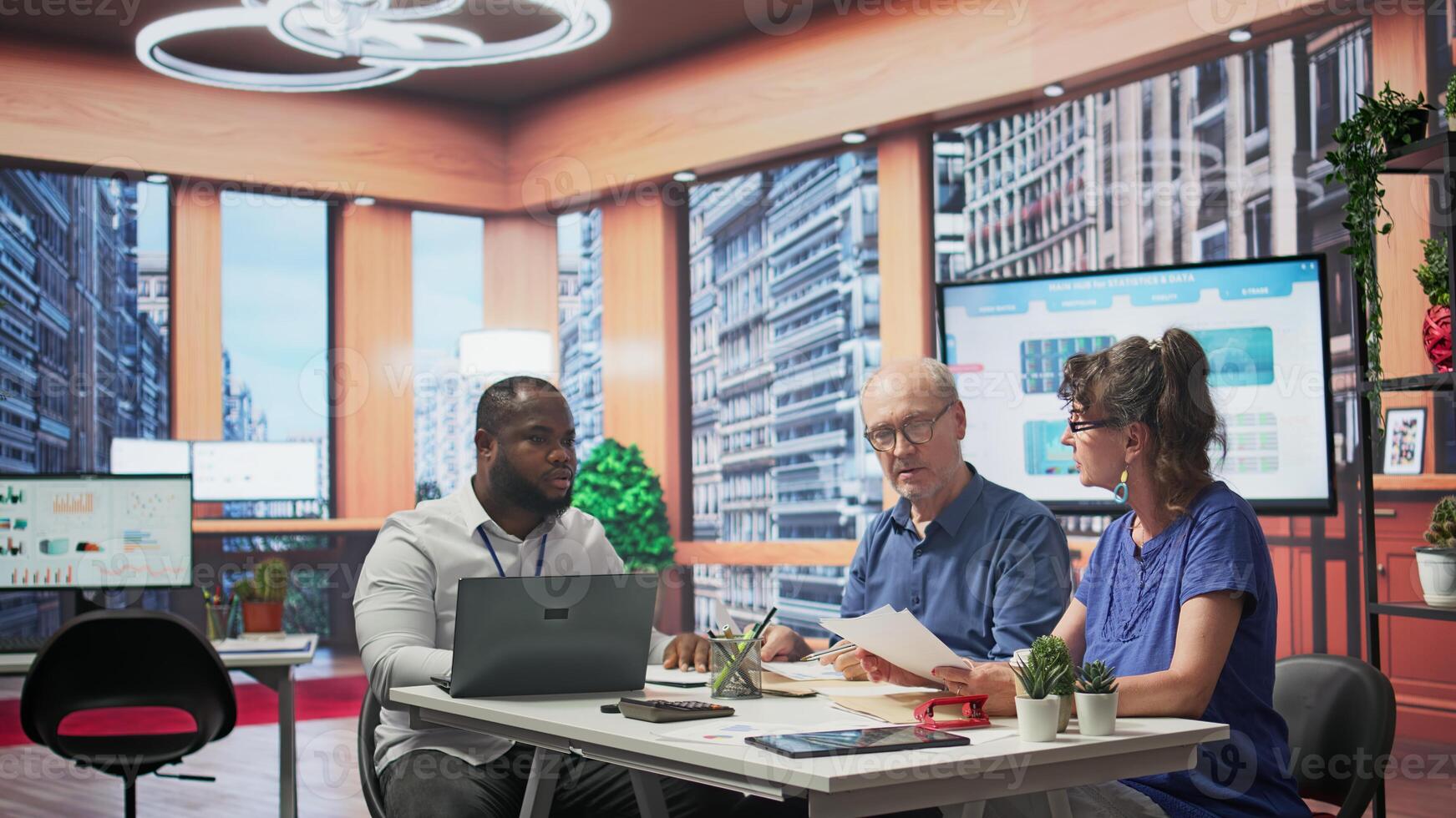 Senior couple receiving tailored financial advice on retirement planning, focusing on maximizing their savings, investment growth and financial security. Increasing their budget. Camera B. photo