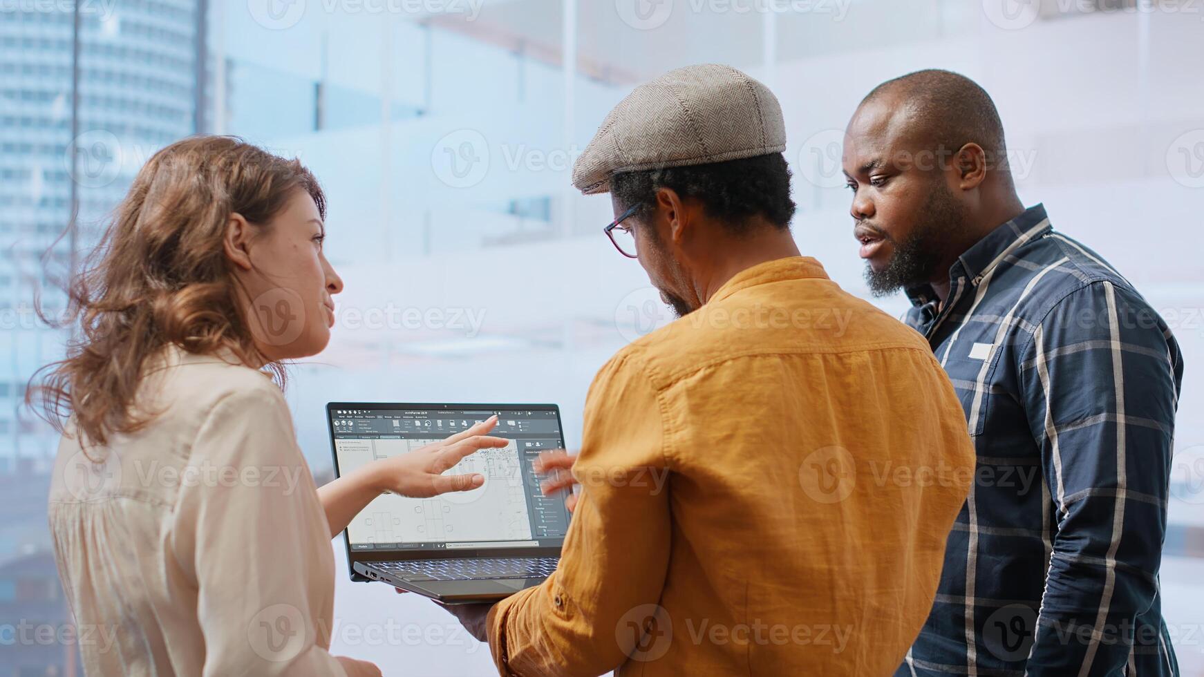 Business team evaluating architectural blueprints layout for high class office space, considering a property investment deal. Professionals negotiating with the realtor for rental agreement. Camera B. photo
