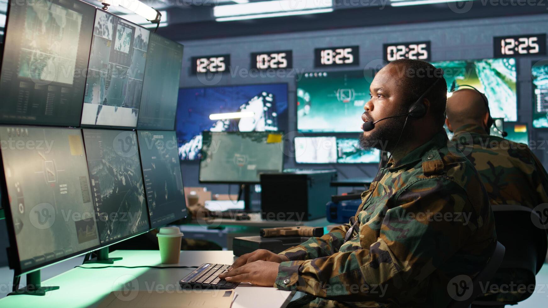 Army telecommunication systems operator providing combat support using gathered information on enemy troops. Military dispatcher managing communications networks in base of operations, camera B photo
