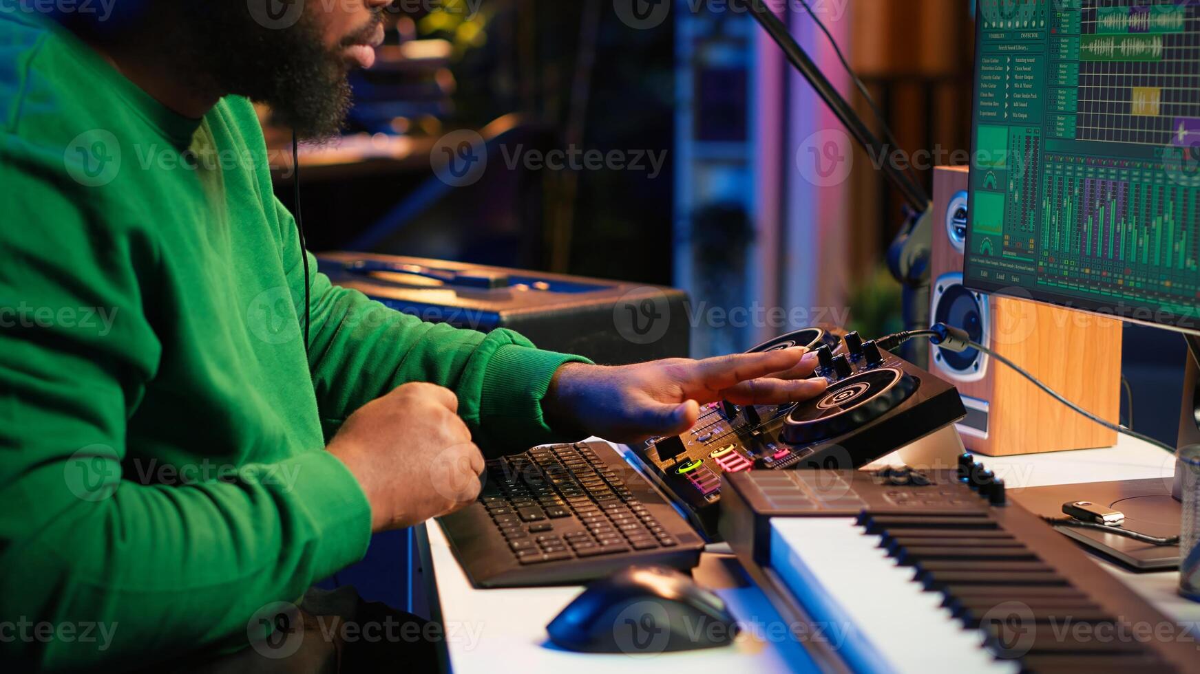 Talented musician creating new soundtracks on mixing console, operating on audio equipment in home studio. Sound technician twisting knobs to edit volume levels on his melody. Camera A. photo
