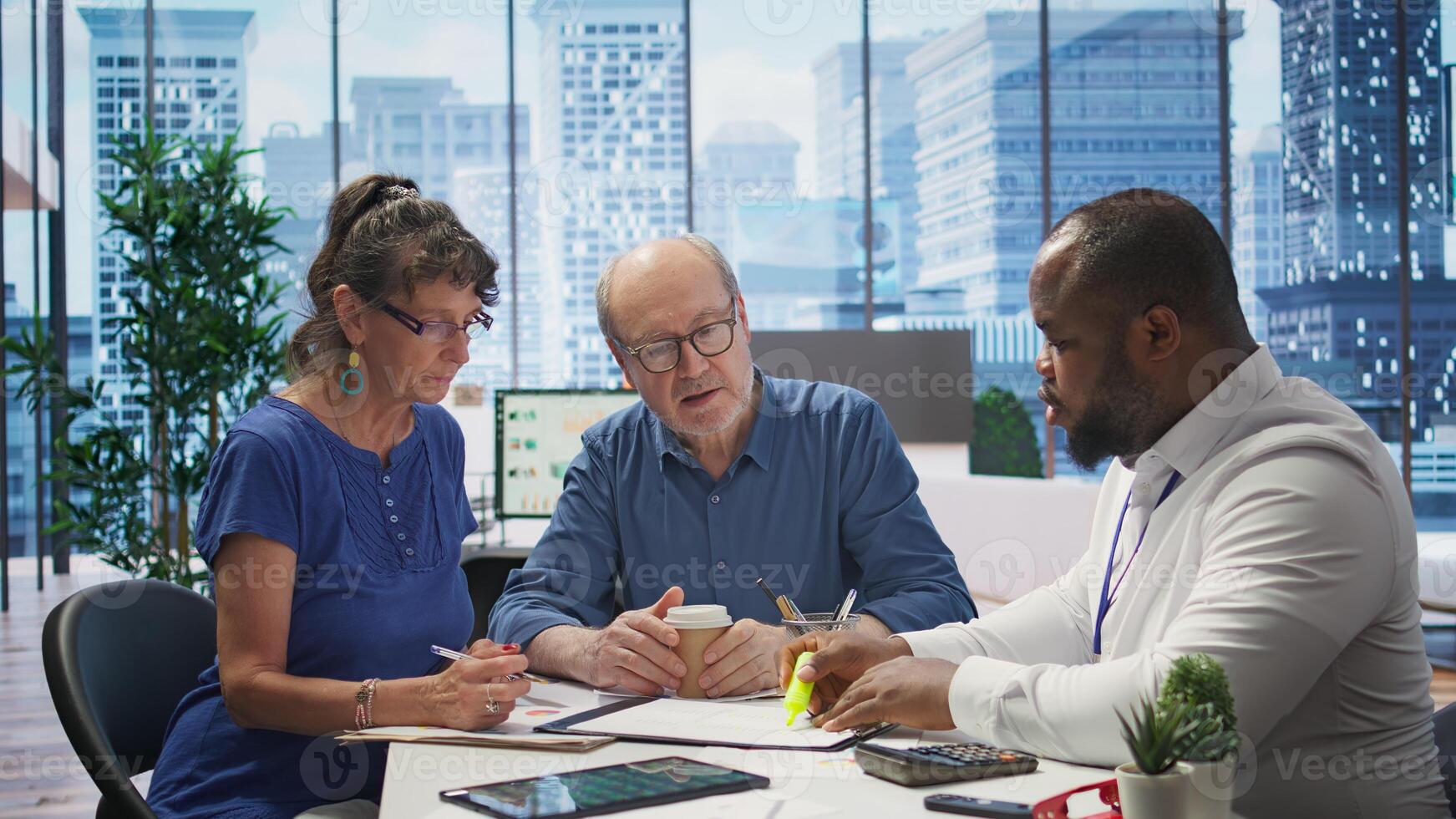 Mature couple receiving professional advice on retirement planning, exploring a new investment strategy and pension options to increase savings. Life insurance income package. Camera B. photo
