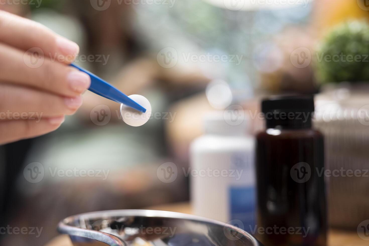 Professional caretaker dividing medicine pills and vitamins for senior man and woman, separating daily doses to ensure effective recovery treatment. Nurse putting capsules in bottles. Close up. photo