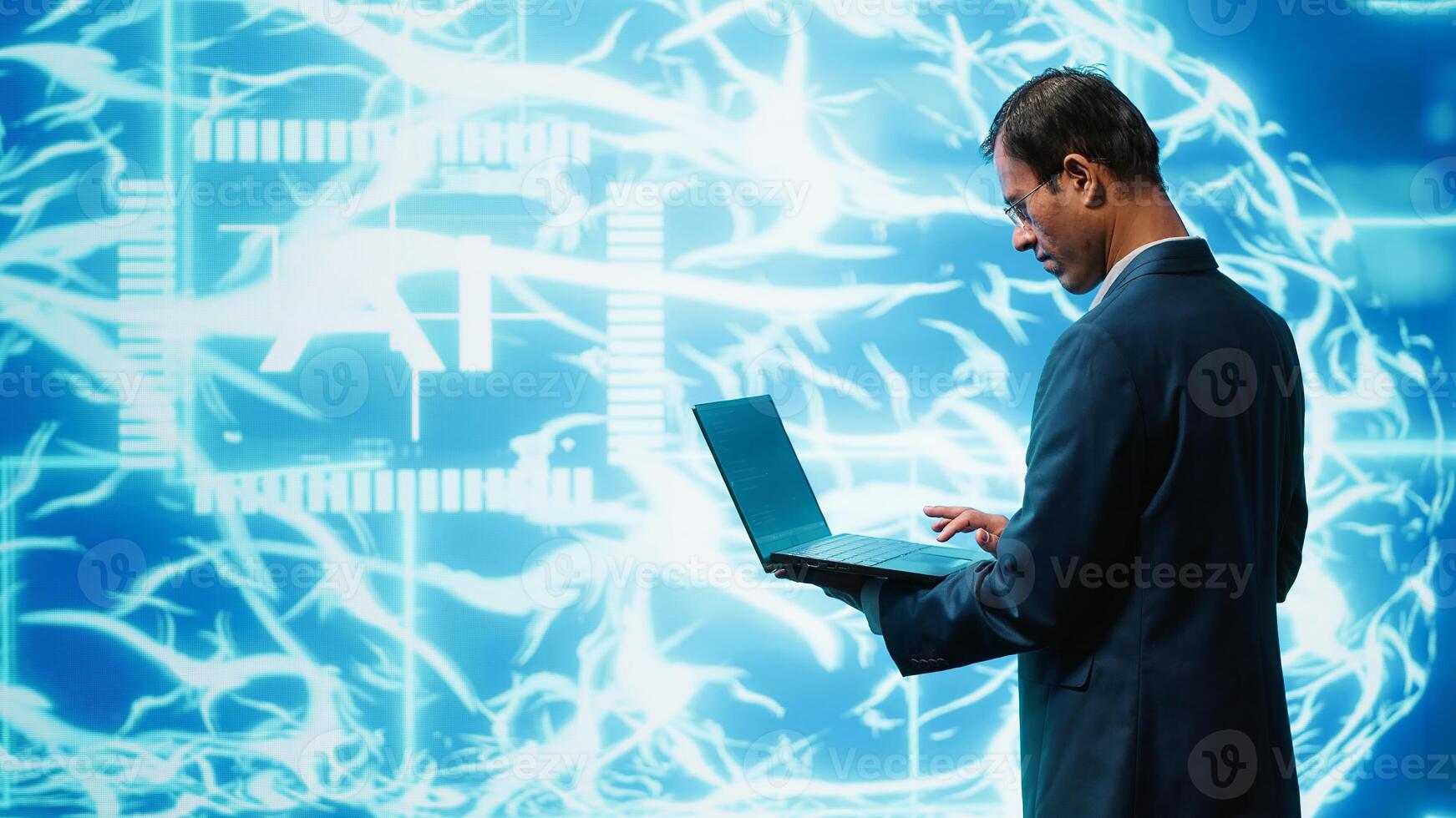 System administrator working on laptop, programming artificial intelligence computing simulating human brain. Man in workspace using notebook, building AI machine learning algorithms, camera A photo