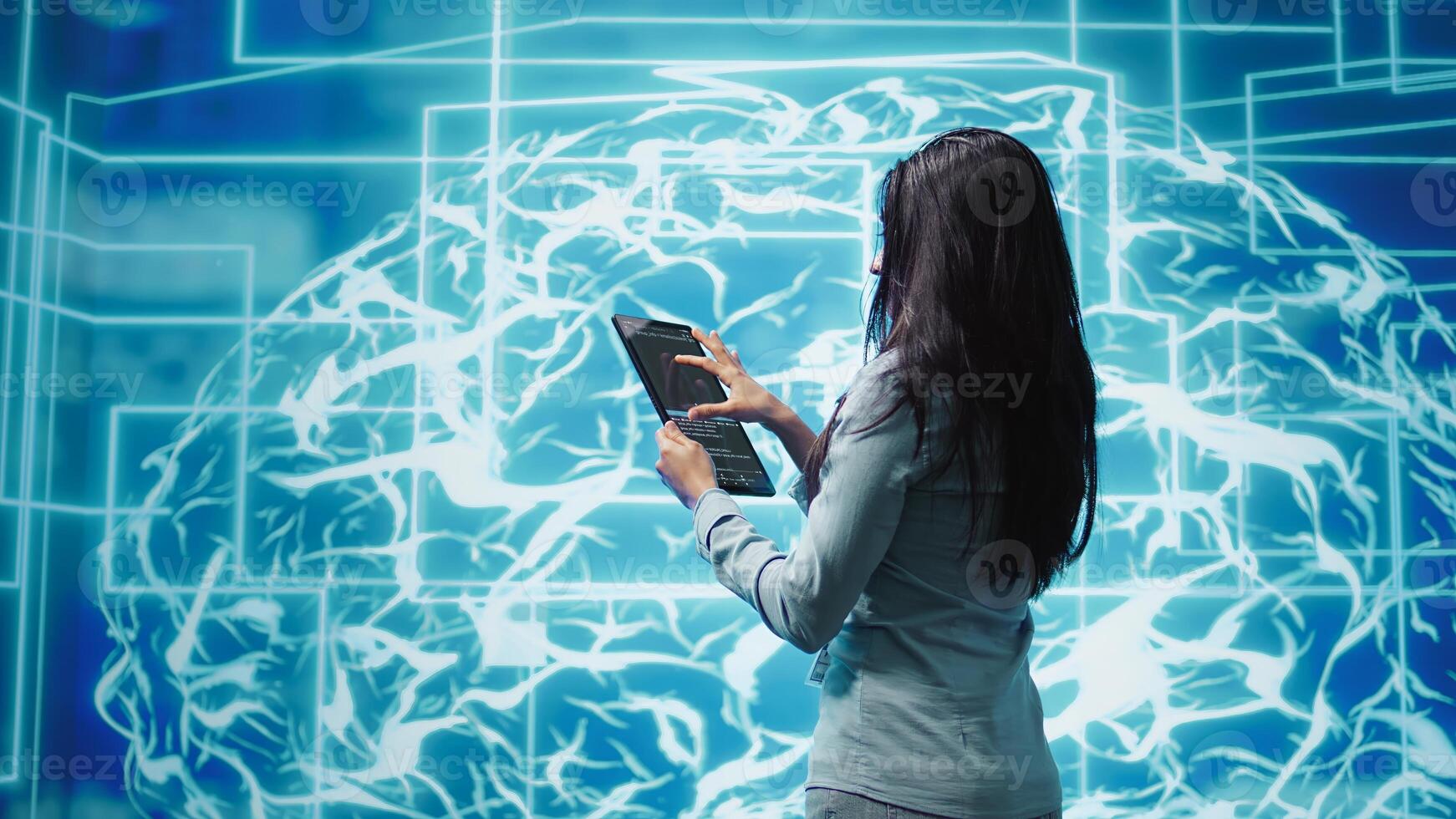 Computer scientist using artificial intelligence computing simulating human brain thought processes. Indian employee working on tablet, developing AI machine learning algorithms, camera B photo