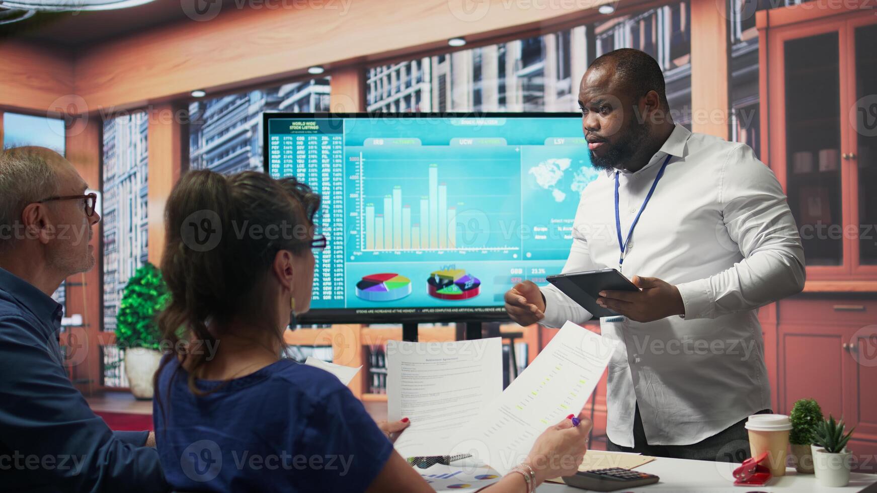 Broker advisor highlighting and pointing out important terms of a contract, middle aged people negotiating with financial expert for a retirement plan and pension option. Camera B. photo