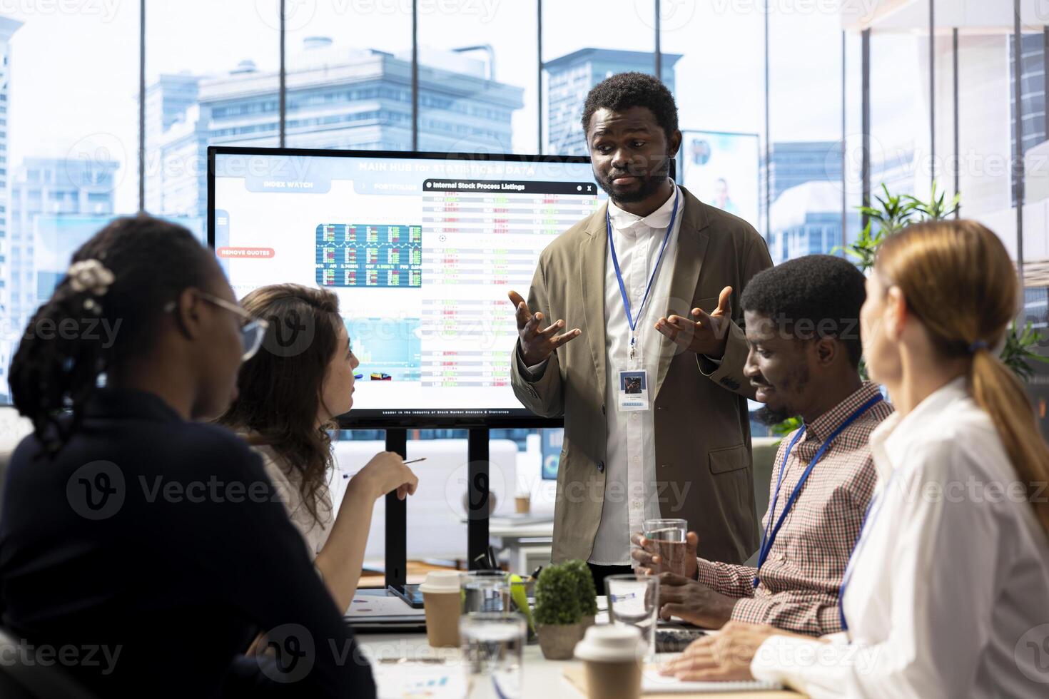 General manager sharing insight on annual infographics reports in enterprise meeting, providing initiatives to enhance operational performance metrics. Group of business associates exchange ideas. photo