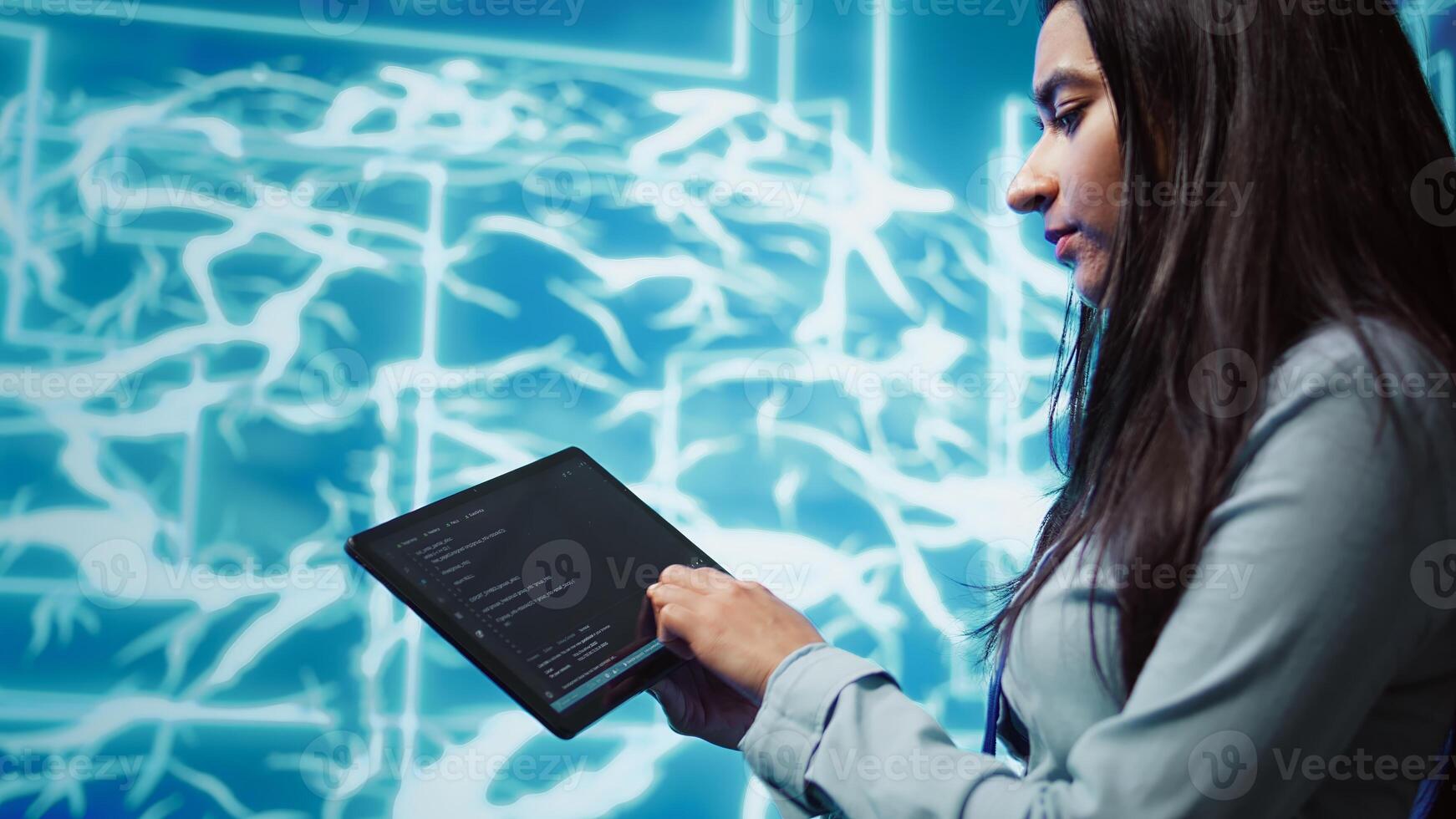 Engineer uses tablet and AI deep neural networks modeled after human brain to solve complex problems. Close up of admin using machine learning model to look at data and better complete tasks, camera B photo