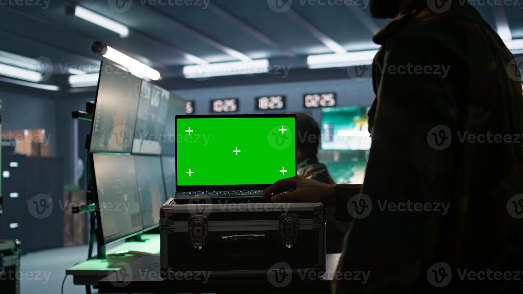Army telecommunication systems operator using green screen gear, providing combat support. Military dispatcher managing communications networks with mockup laptop, camera B photo