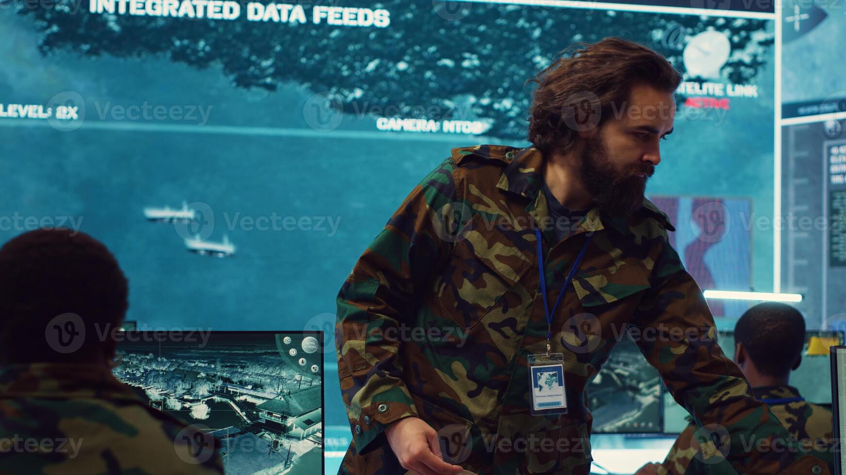 Commanding general of the navy division reviews warfare information within a mission case file, special operation reconnaissance to support field troops. Briefing his military squad. Camera A. photo