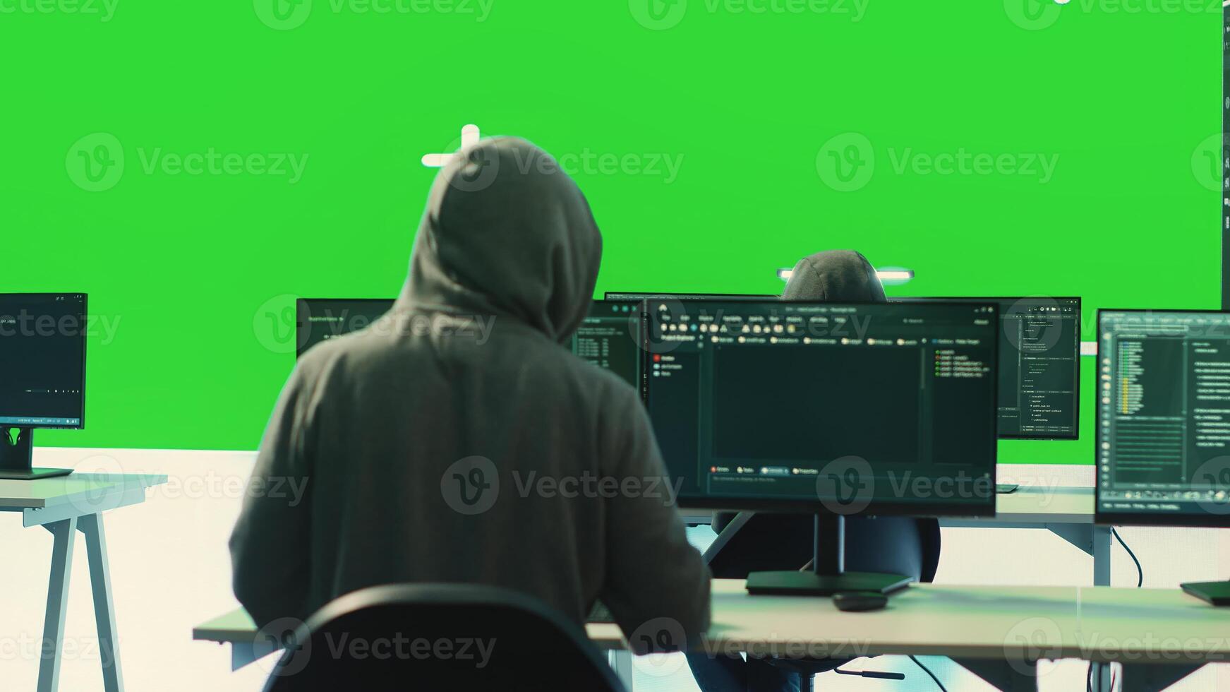 Cyber security experts working with mockup layout on a big screen, using encryption and IT security in a governmental agency. Focusing on cyber operations to hack rival states systems. Camera A. photo