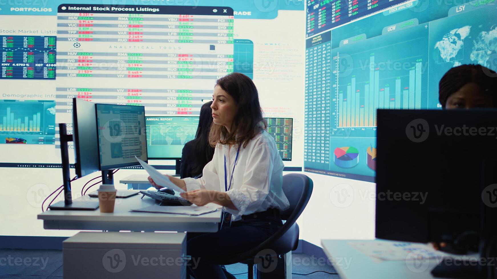 Business specialist reviewing key performance indicators within the firm activity. Conducting evaluations in order to help with global corporation expansion, enhance team efficiency. Camera B. photo