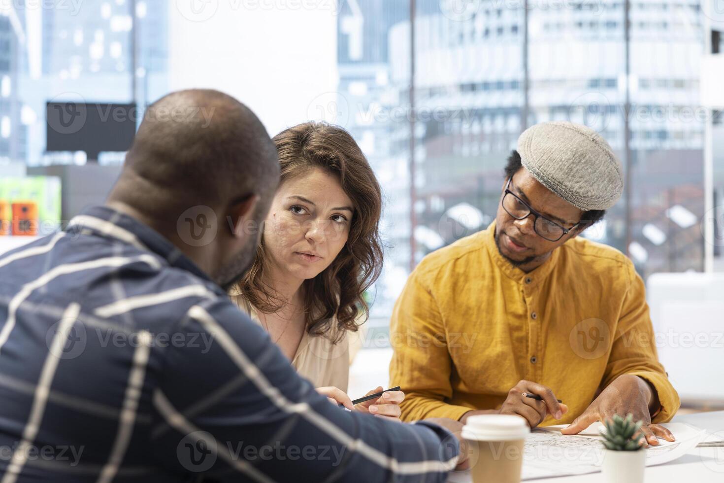 Entrepreneur evaluating office building potential before reaching an agreement, working with realtors experts to strategize investment opportunity. Planning high class office relocation. photo