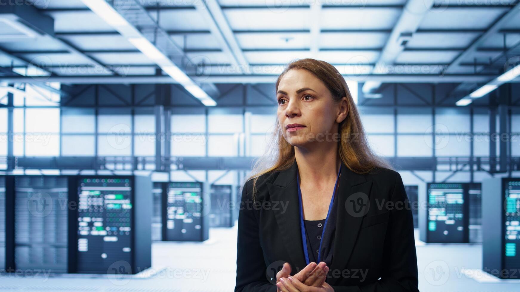 Manager inspecting server room equipment, walking between supercomputers. Supervisor doing evaluation of data center location, checking equipment, monitoring performance, camera B photo