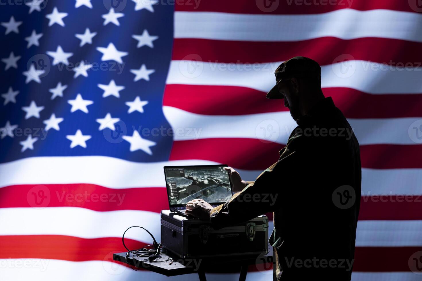 US military officer using target acquisition technology to detect location of enemies hiding. Soldier using satellite equipment to identify terrorists threatening country photo