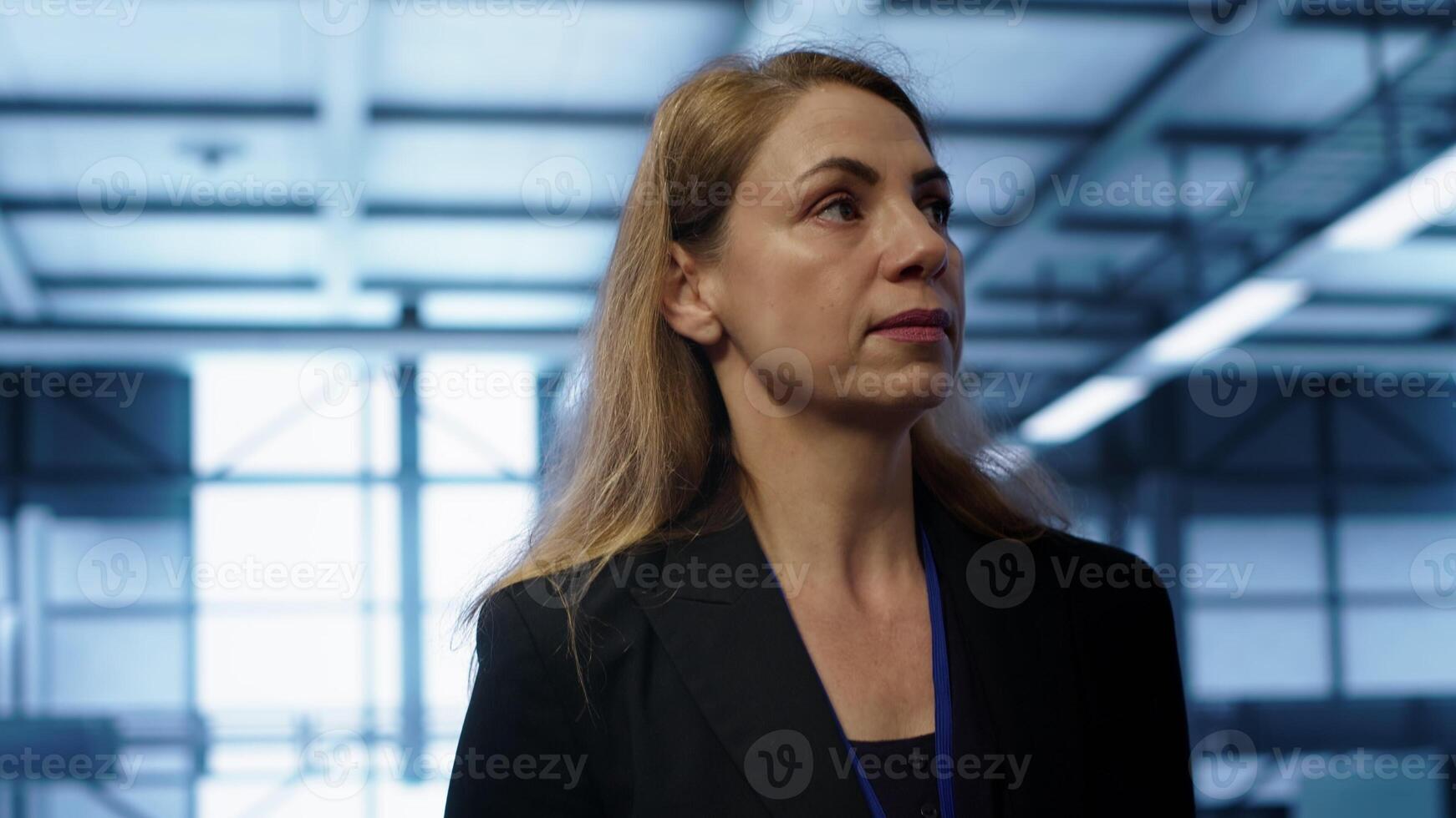 Manager inspecting server room equipment, walking between supercomputers. Supervisor doing evaluation of data center location, checking equipment, monitoring performance, camera A photo