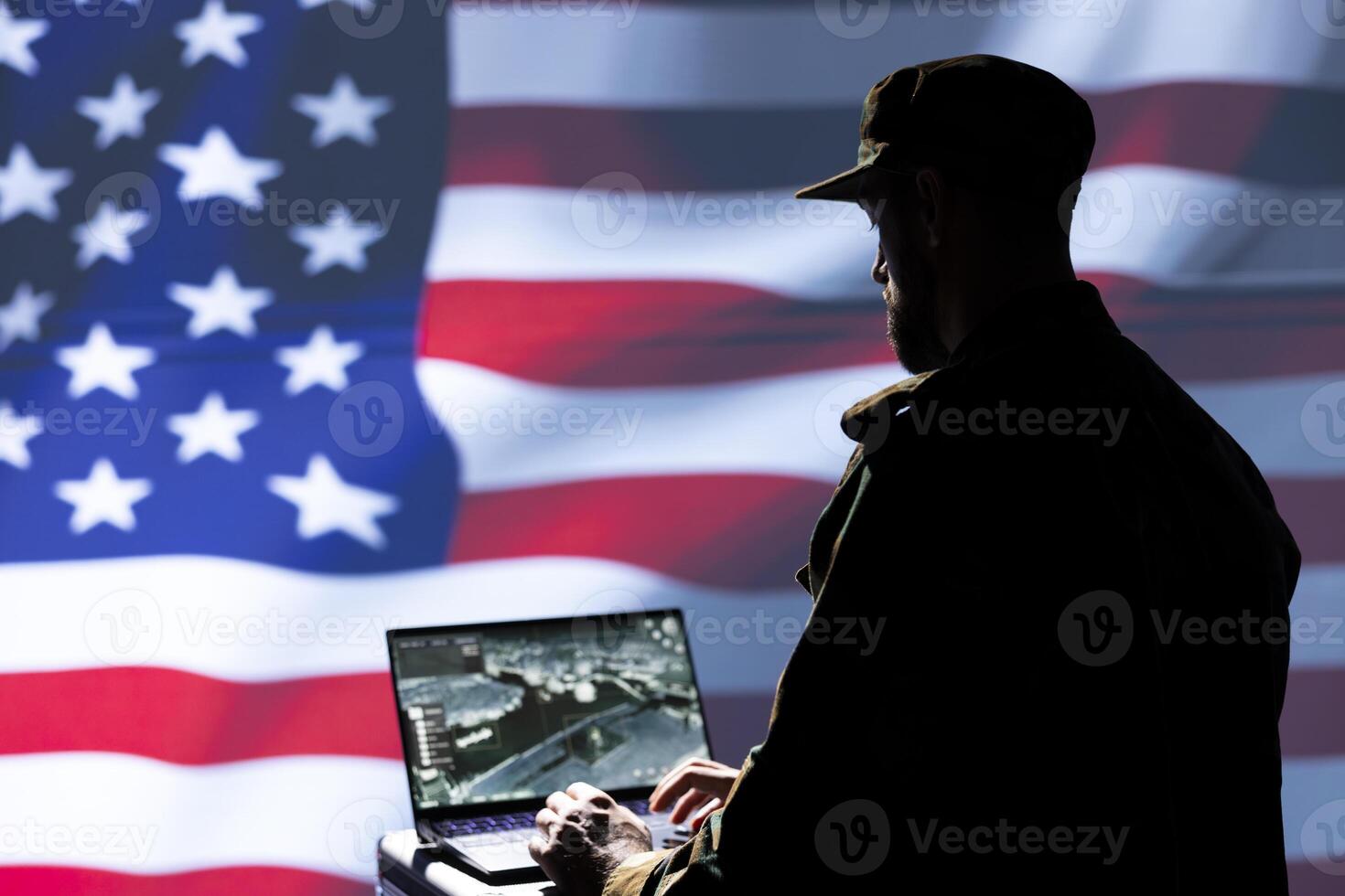 US Air Force agent using radar system on laptop to detect incoming ballistic missiles. American NATO army soldier scanning rockets approaching borders, deploying shields, United States flag photo