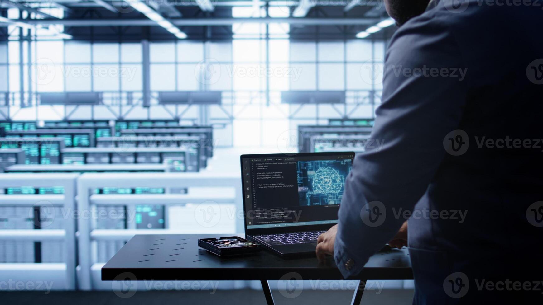 Engineer in server hub works with artificial intelligence computerized model simulating human brain. Man working on laptop with AI machine learning algorithms using pattern recognition, camera B photo