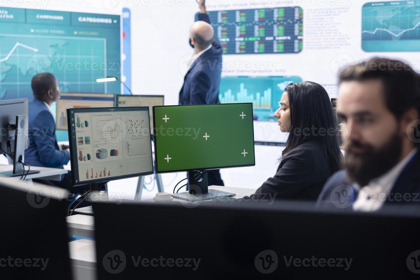 Business analyst reviewing performance indicators in office space, looking at a pc display with isolated copy space. Woman working on enterprise global expansion plans. Teamwork. photo