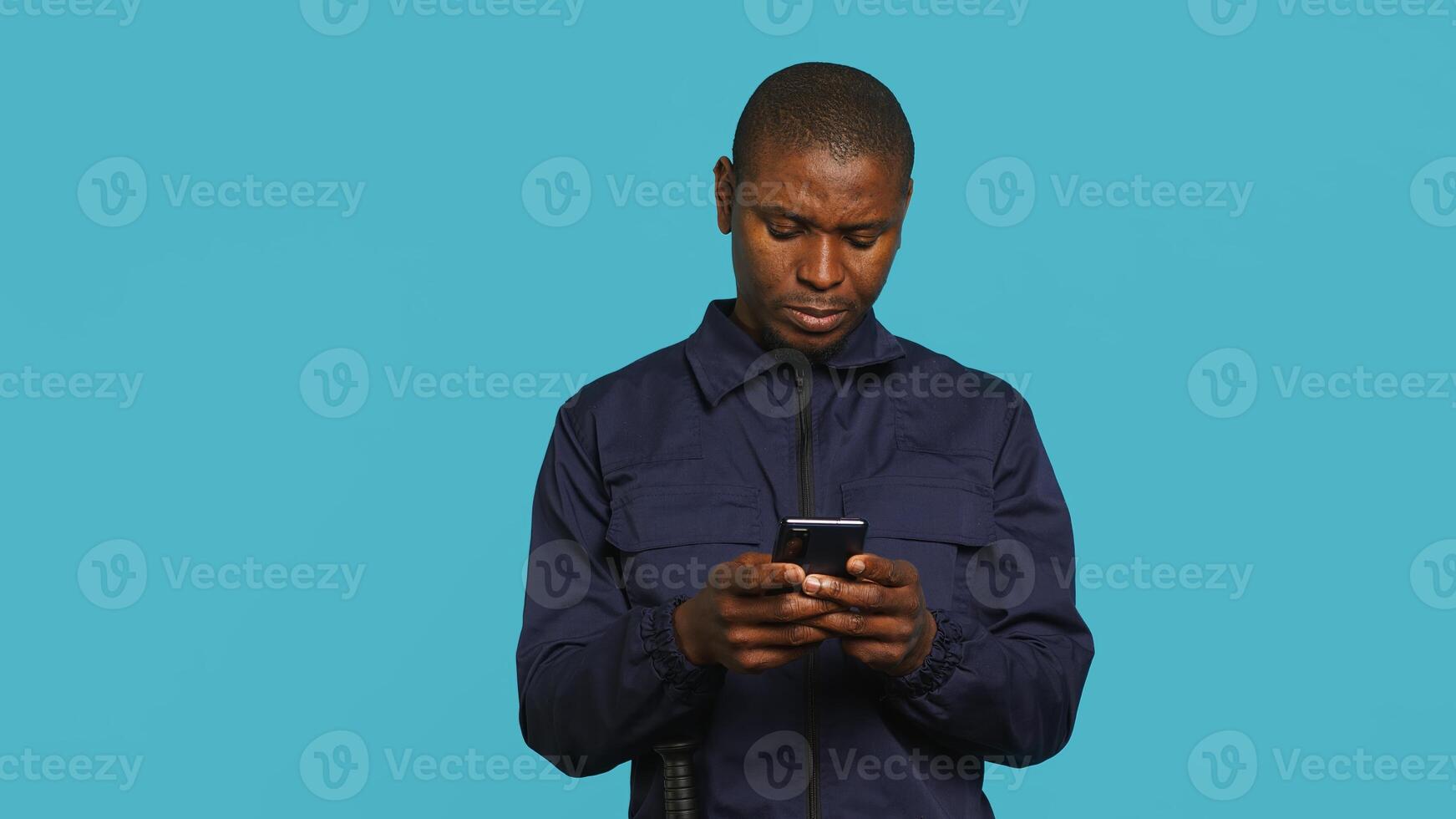 Headshot portrait of security staff member evicting trespassers with baton after spotting them with flashlight. Close up of patrolling agent using truncheon and lantern to evict intruders, camera A photo
