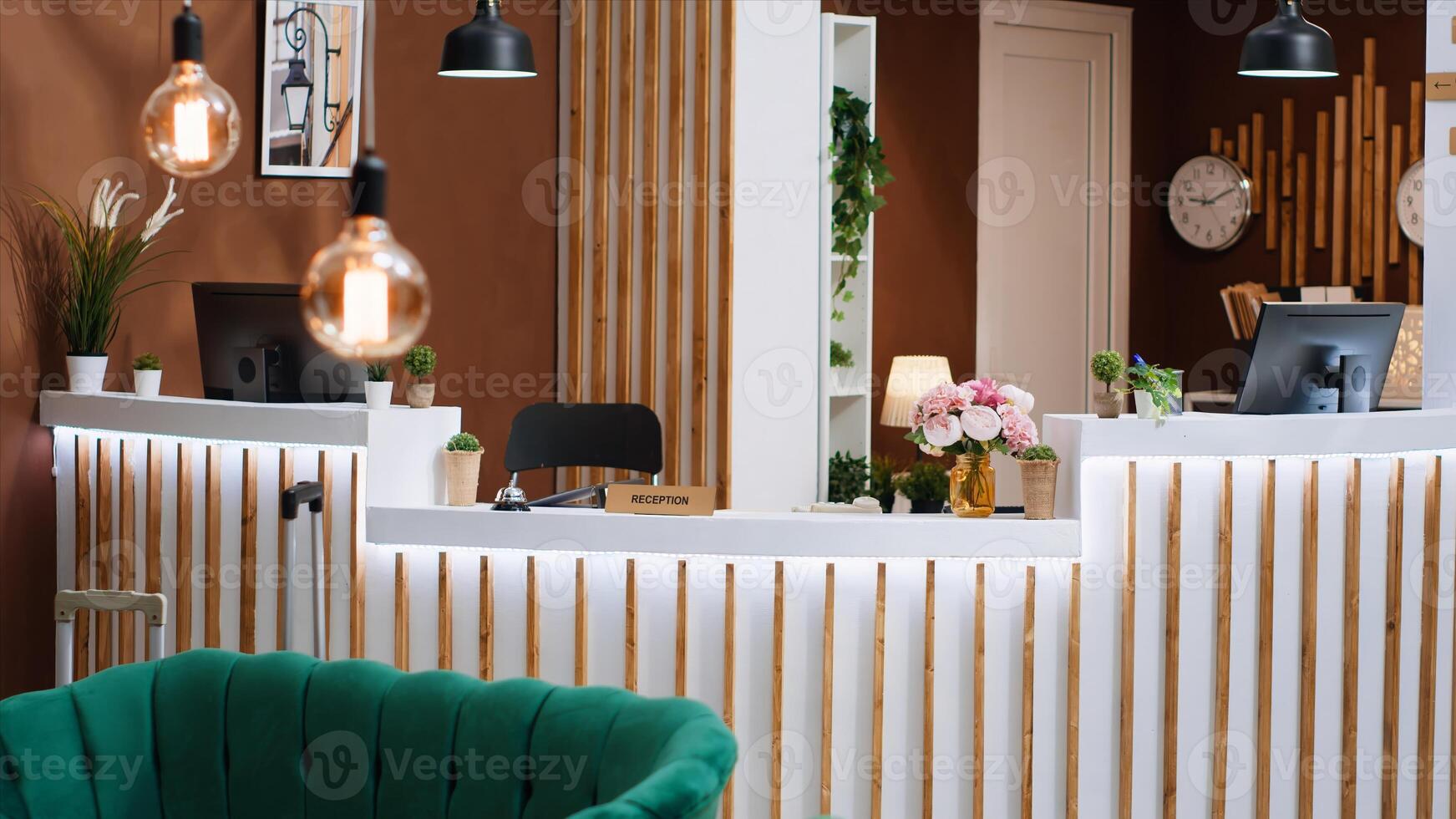 Expensive hotel reception with empty modern front desk, lounge area with luxurious furniture and elegant registration counter. Stylish holiday retreat with beautiful interior design. photo