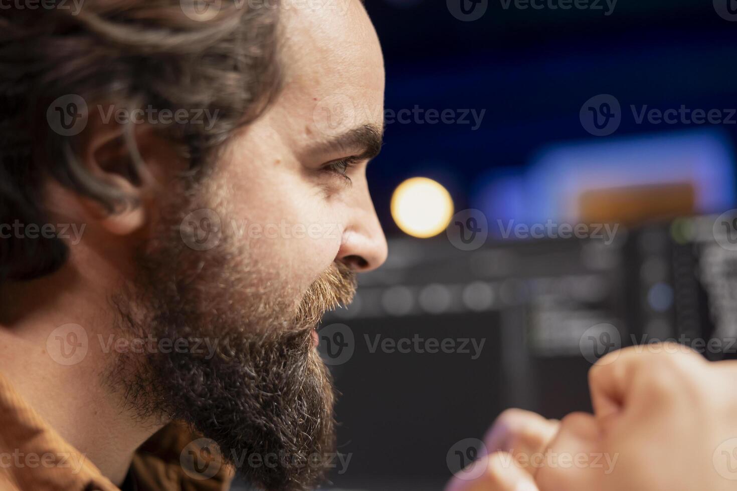 Ecstatic programmer celebrating after filtering malicious traffic from cybercriminals attempting to steal company data. Man excited about accomplishment, preventing malware photo