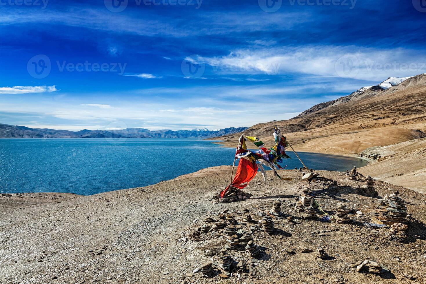 Buddhist prayer flags lungta at Himalayan lake photo