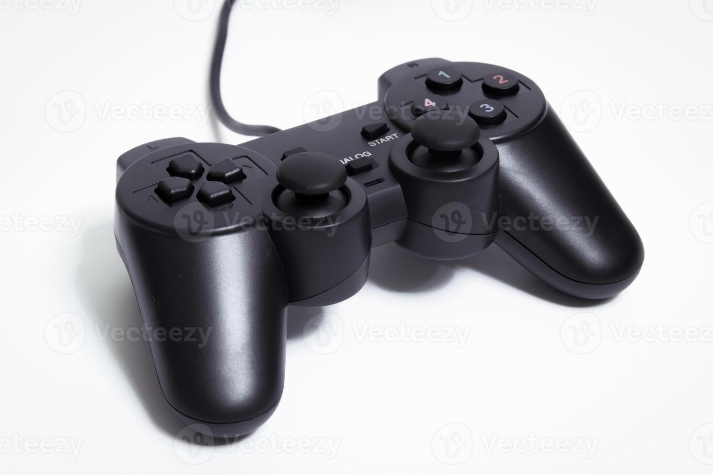 Black controller on white background, game device, Joystick on a white background. photo