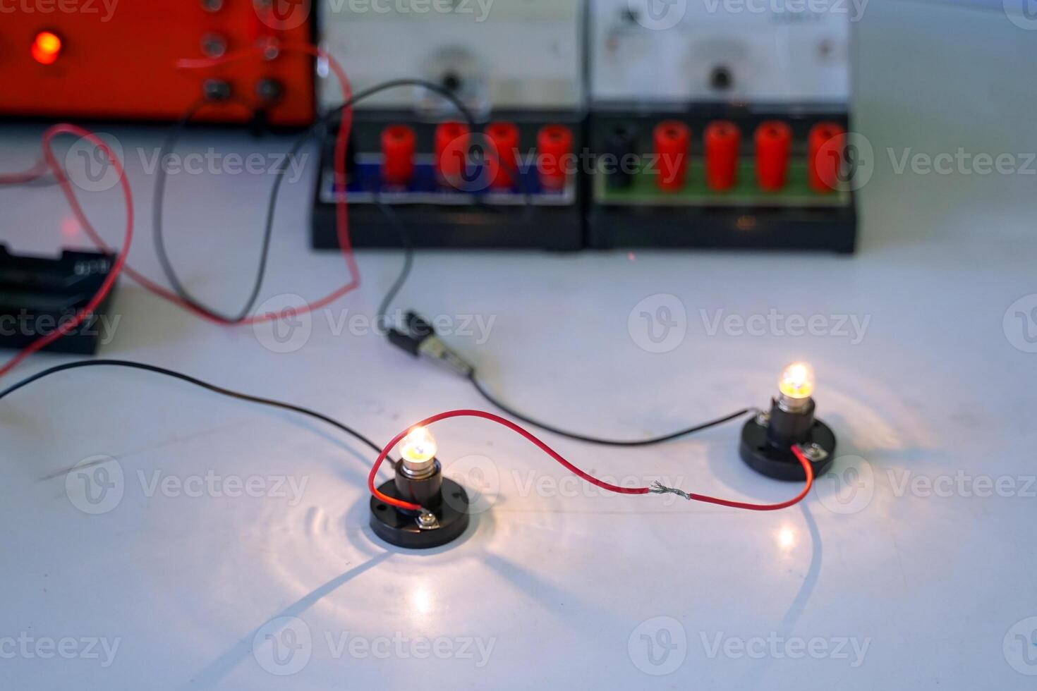 students are conducting experiments on basic electrical circuits. Concept of science classroom, learning science, science skills, learning, science experiments. photo