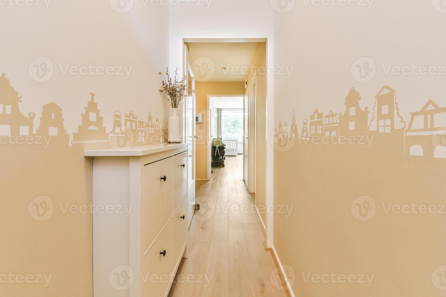 A hallway with a wall painted with a city skyline photo