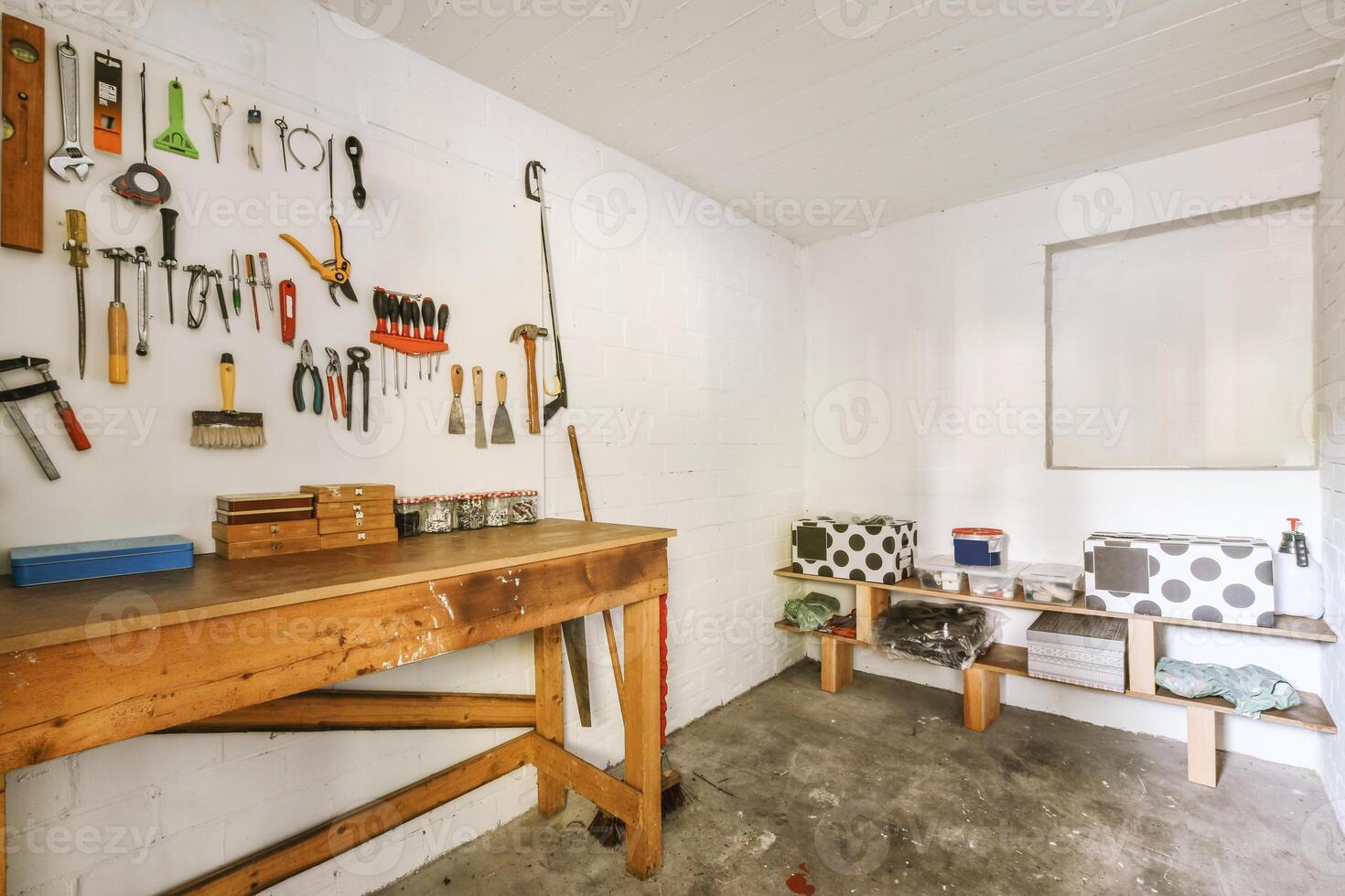 A garage with a workbench and tools on it photo