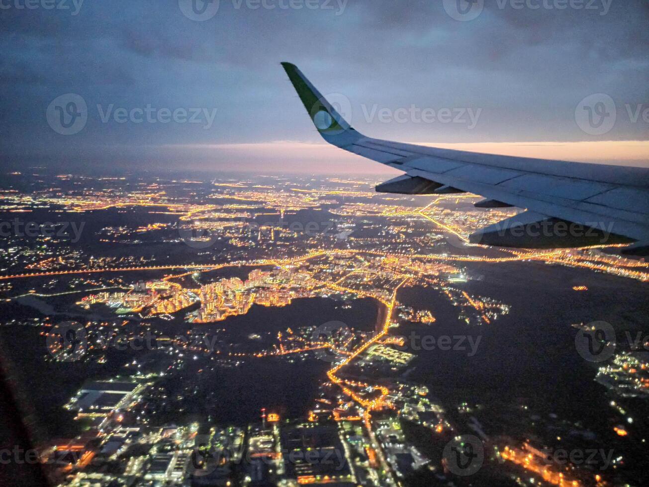 A snapshot of the city at night from the height of the plane's flight photo