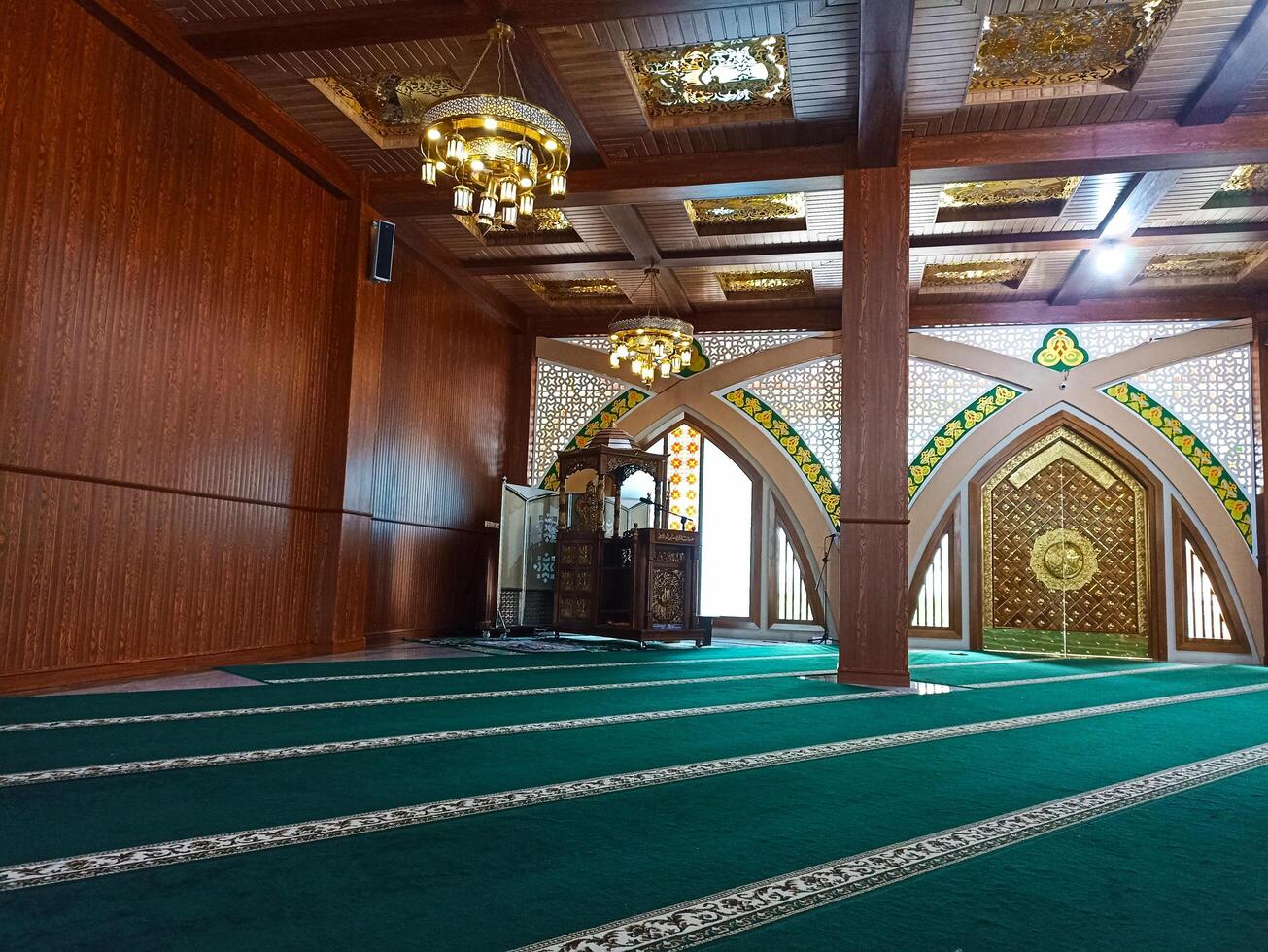 Wonosobo, Central Java, Indonesia - May 19 2024 Unsiq mosque inside a beautiful mosque with walls and pillars made of brown wood photo