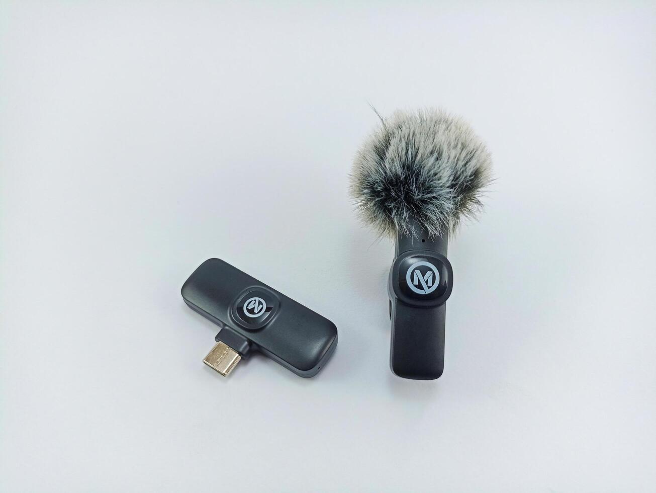 Wonosobo, Central Java, Indonesia - September 6, 2024 Mixio W13 brand wireless microphone device on white background photo