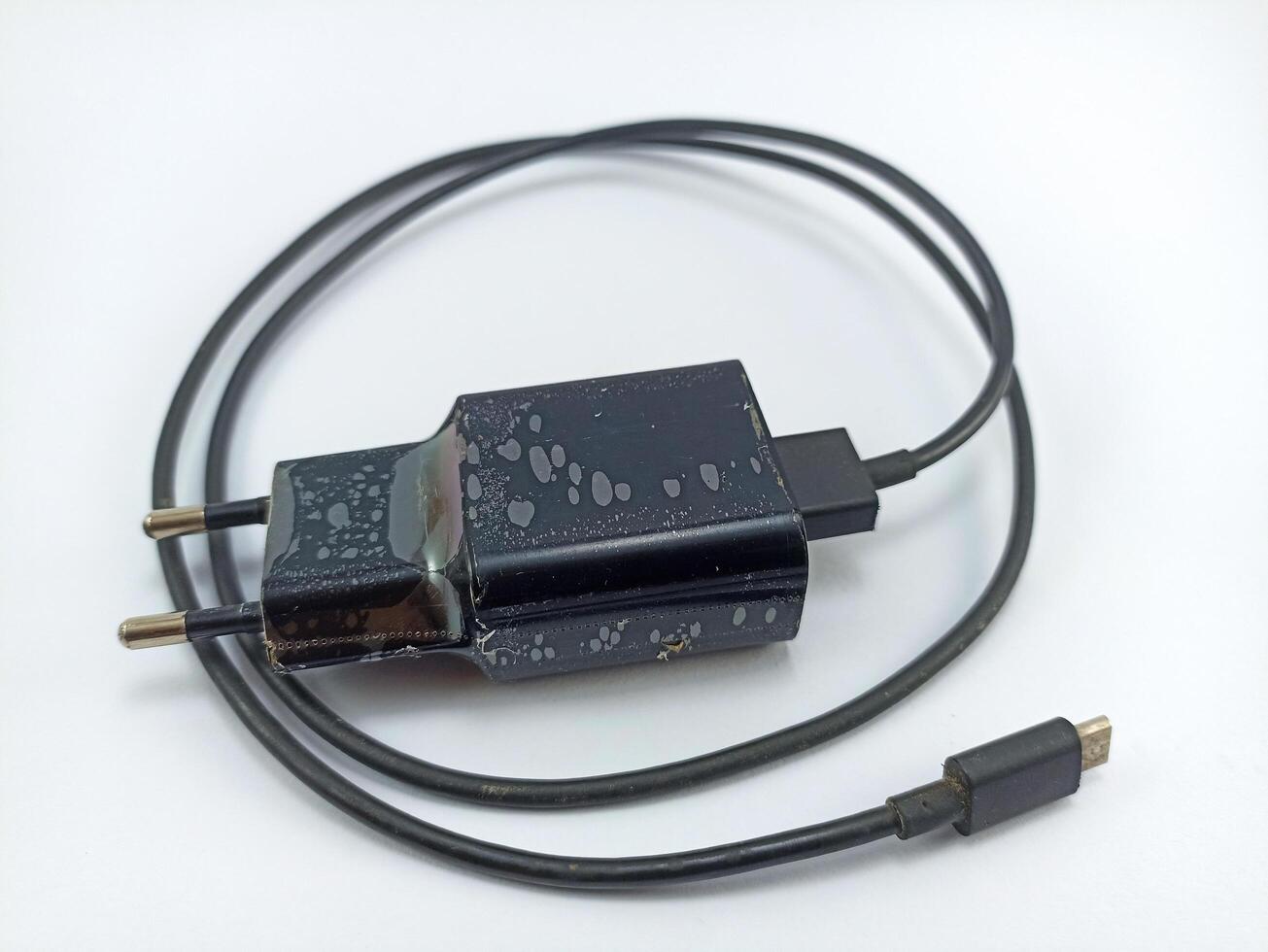 usb type c smartphone charger is black on a white background photo