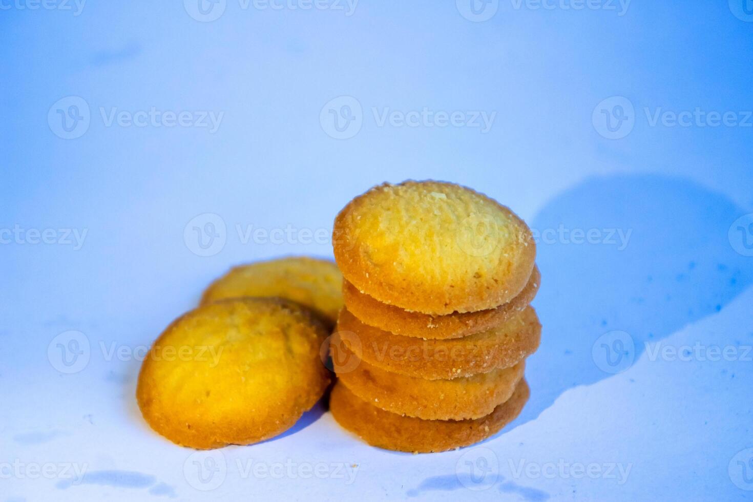 Danish butter cookies, stack of golden chocolate butter cookies isolated on white background, sweet pastry photo