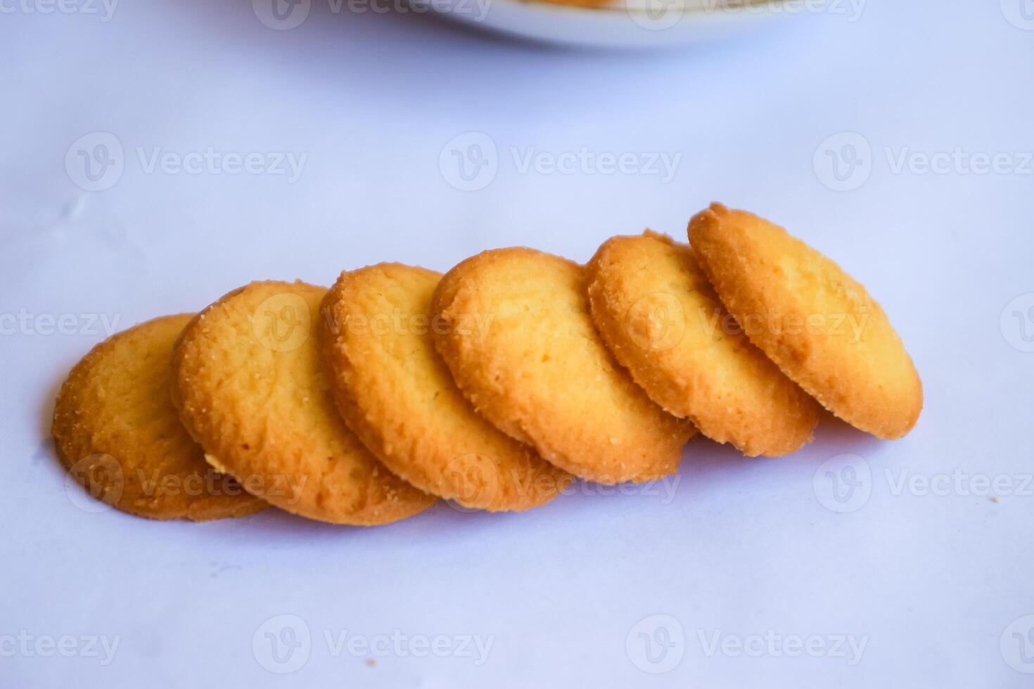Danish butter cookies, stack of golden chocolate butter cookies isolated on white background, sweet pastry photo