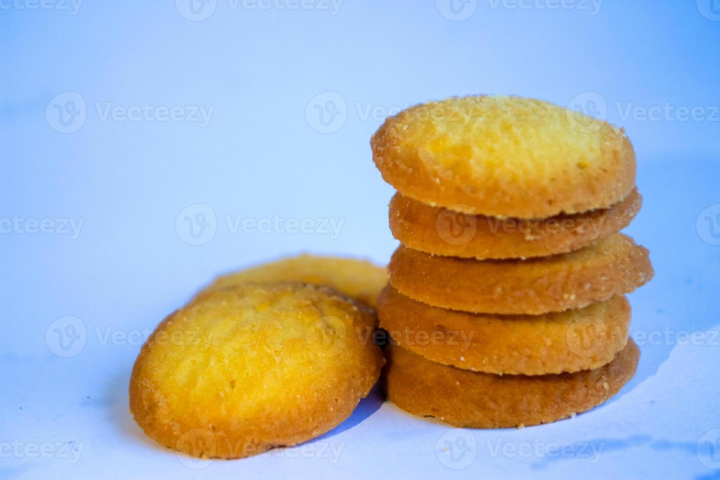 Danish butter cookies, stack of golden chocolate butter cookies isolated on white background, sweet pastry photo