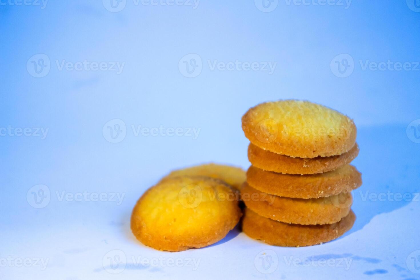 Danish butter cookies, stack of golden chocolate butter cookies isolated on white background, sweet pastry photo