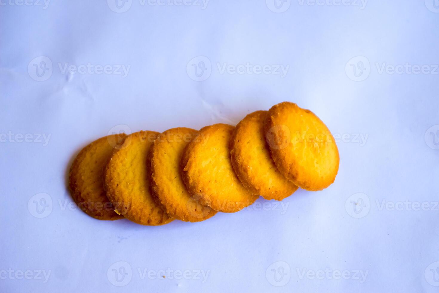 Danish butter cookies, stack of golden chocolate butter cookies isolated on white background, sweet pastry photo