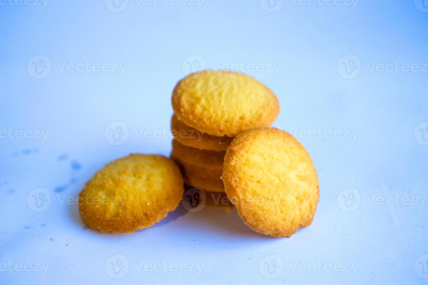 Danish butter cookies, stack of golden chocolate butter cookies isolated on white background, sweet pastry photo