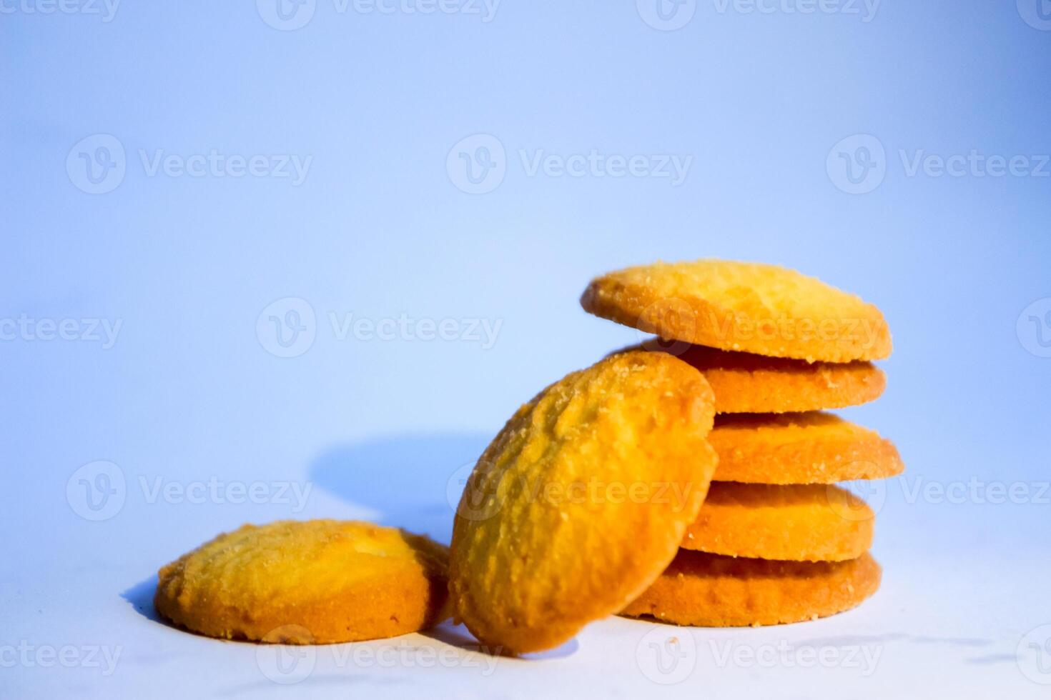 Danish butter cookies, stack of golden chocolate butter cookies isolated on white background, sweet pastry photo