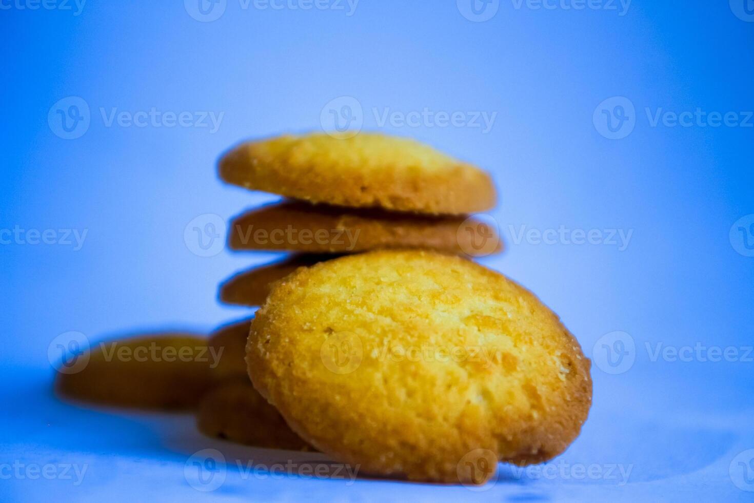 Danish butter cookies, stack of golden chocolate butter cookies isolated on white background, sweet pastry photo