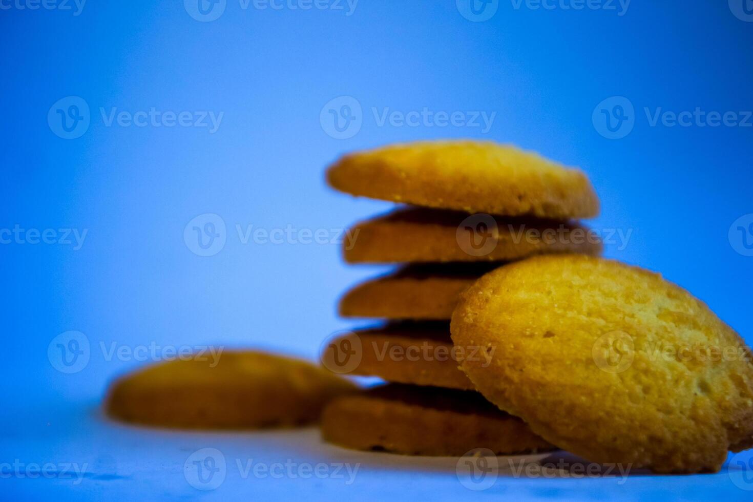 Danish butter cookies, stack of golden chocolate butter cookies isolated on white background, sweet pastry photo
