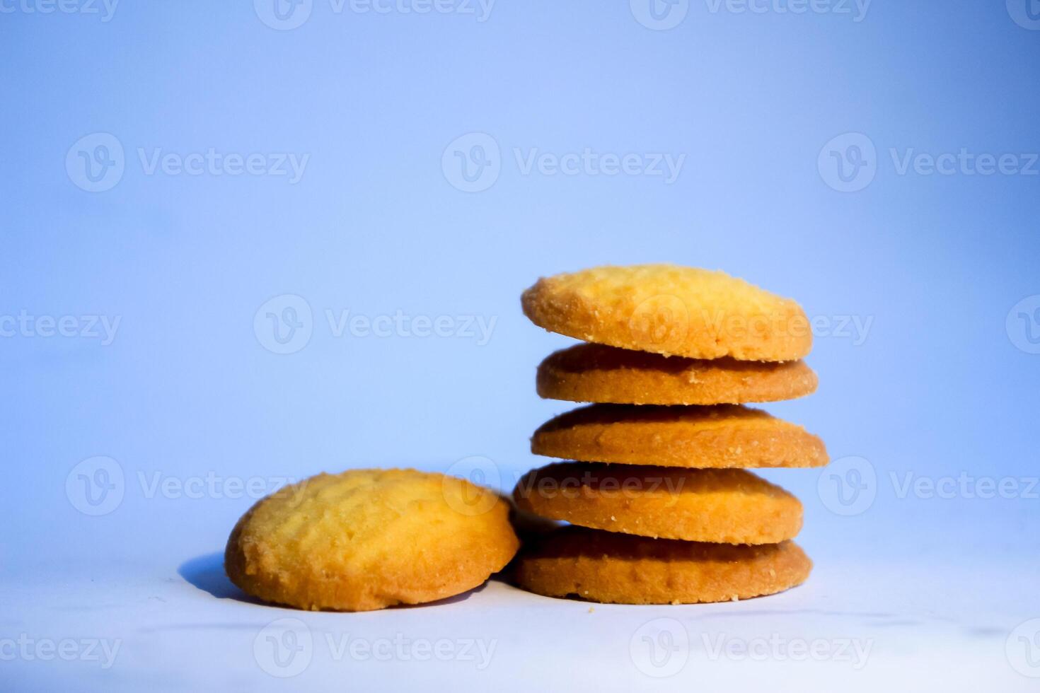 Danish butter cookies, stack of golden chocolate butter cookies isolated on white background, sweet pastry photo
