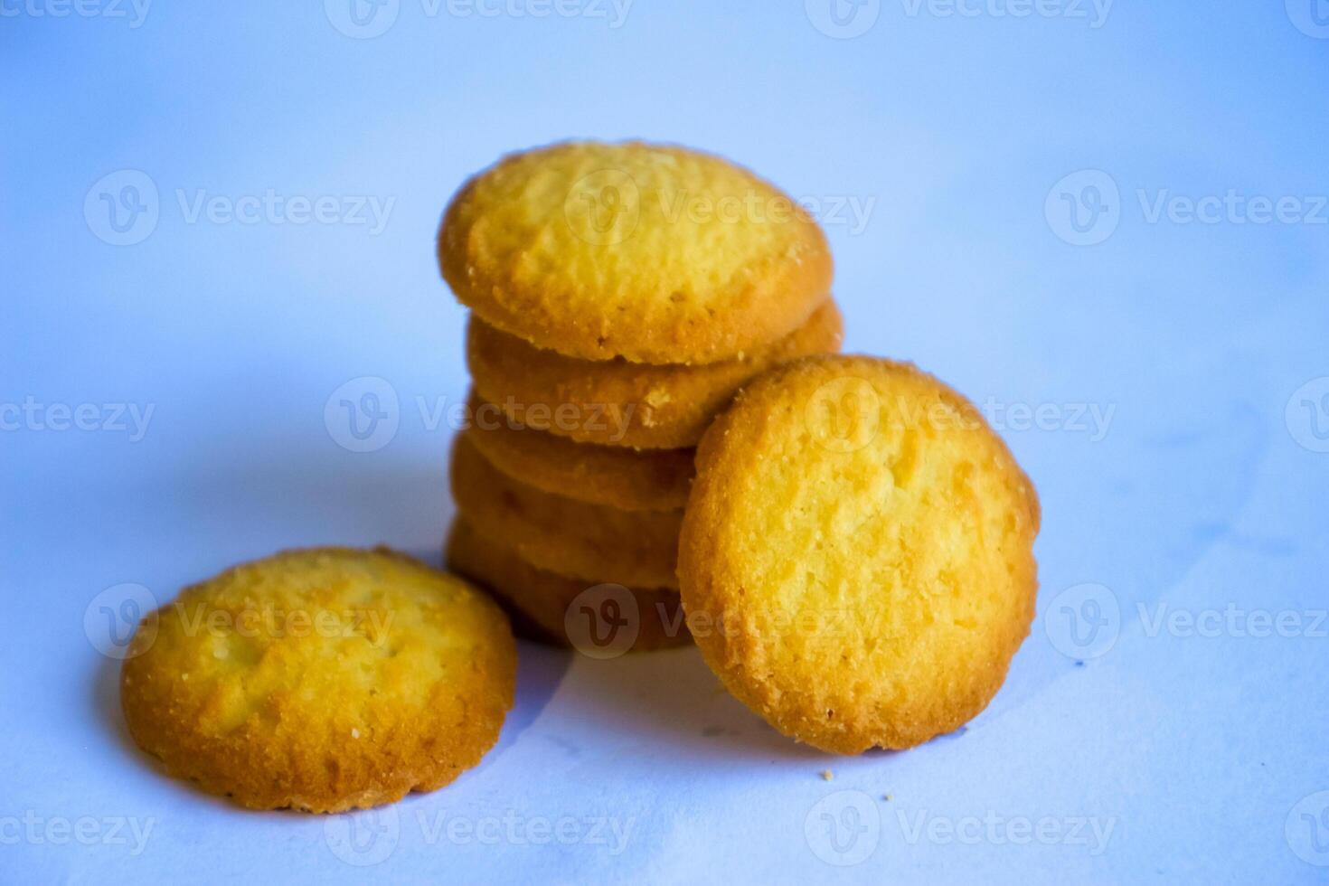 Danish butter cookies, stack of golden chocolate butter cookies isolated on white background, sweet pastry photo