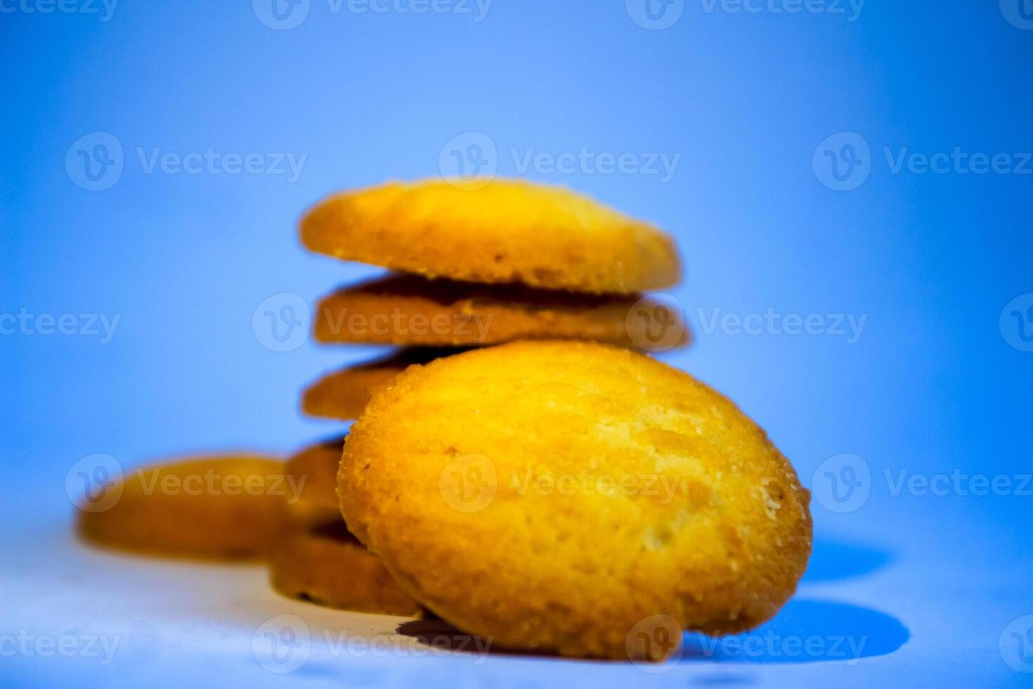 Danish butter cookies, stack of golden chocolate butter cookies isolated on white background, sweet pastry photo