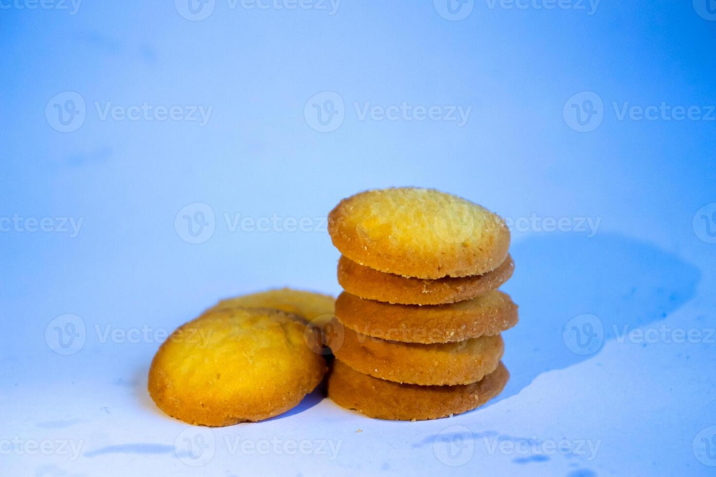 Danish butter cookies, stack of golden chocolate butter cookies isolated on white background, sweet pastry photo